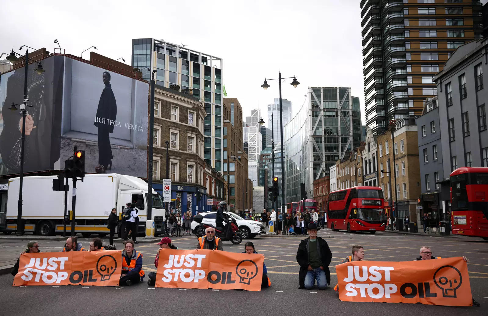 Activists block a road during a "Just Stop Oil" protest, in London, Britain, October 15, 2022. (Reuters)