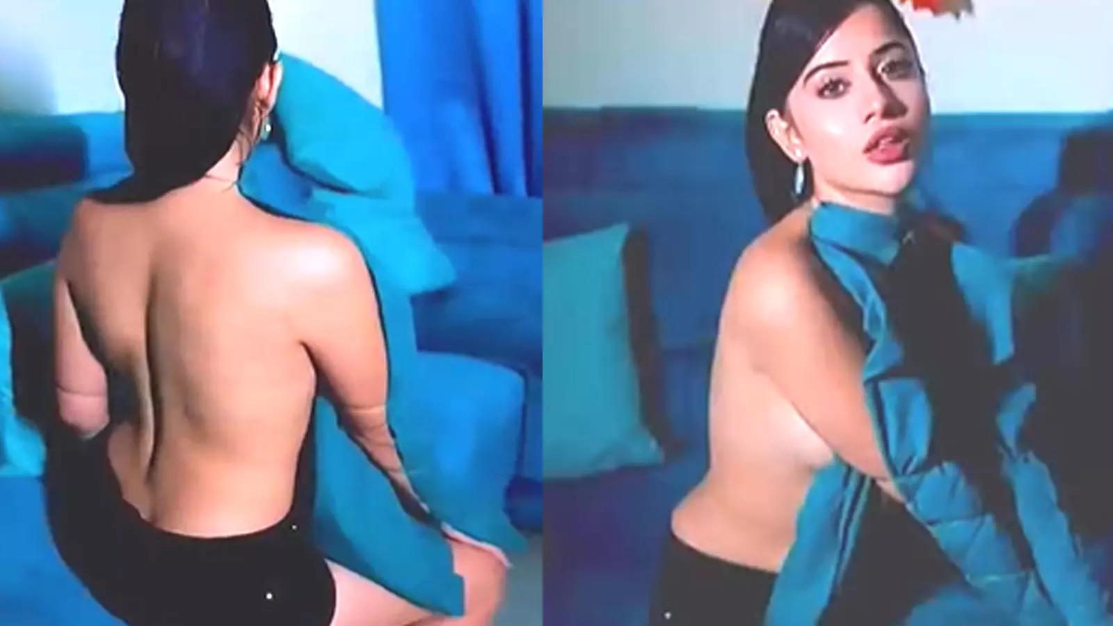Urfi Javed goes backless as she flaunts her unique way of wearing a shirt;  netizens react | Hindi Movie News - Bollywood - Times of India