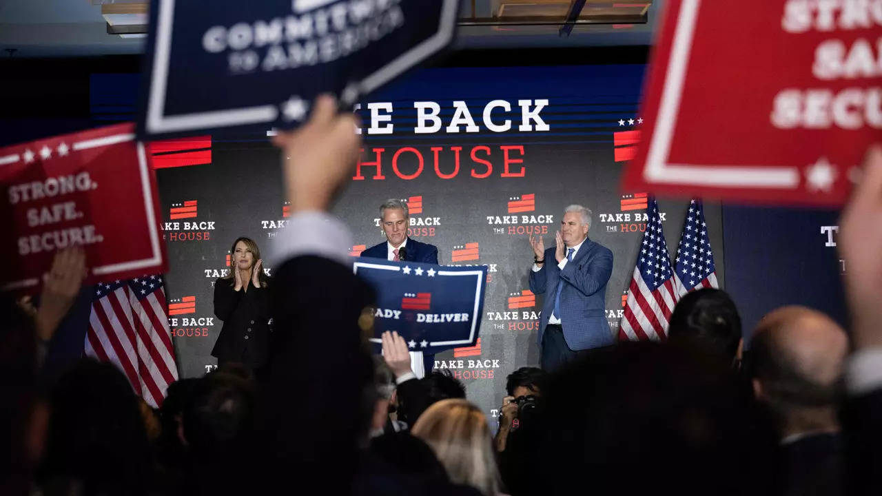 Republican Chair Ronna McDaniel (L) and Rep. Tom Emmer (R-MN) cheer with others as House Minority Leader Kevin McCarthy (R-CA) (C) speaks at his election night watch party (AFP)