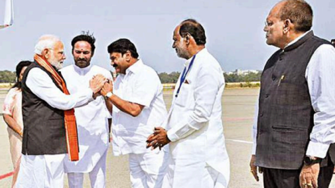 Union minister Kishan Reddy and state minister Talasani Srinivas Yadav receive Prime Minister Narendra Modi at Begumpet airport