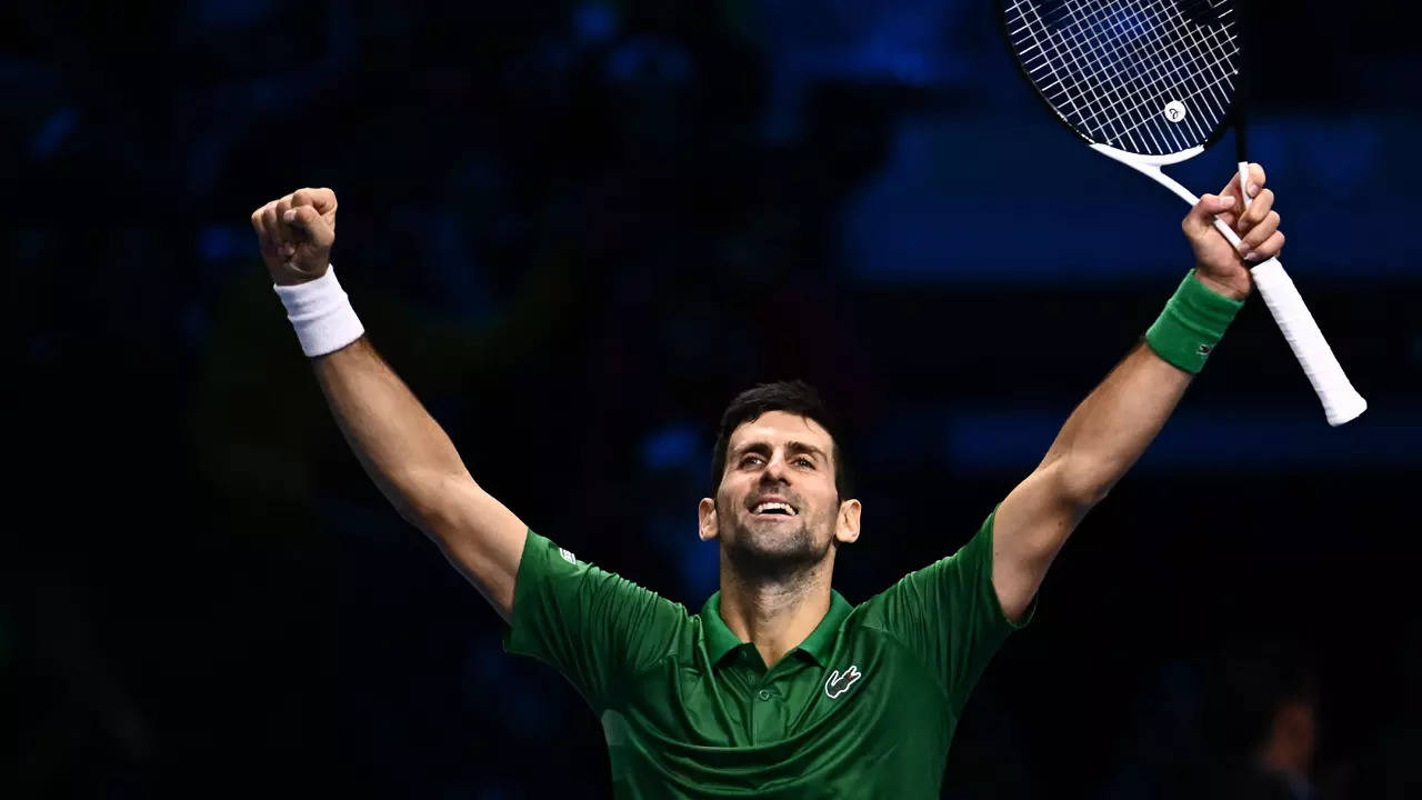 Serbia's Novak Djokovic celebrates after winning his round-robin match against Russia's Daniil Medvedev. (AFP Photo)
