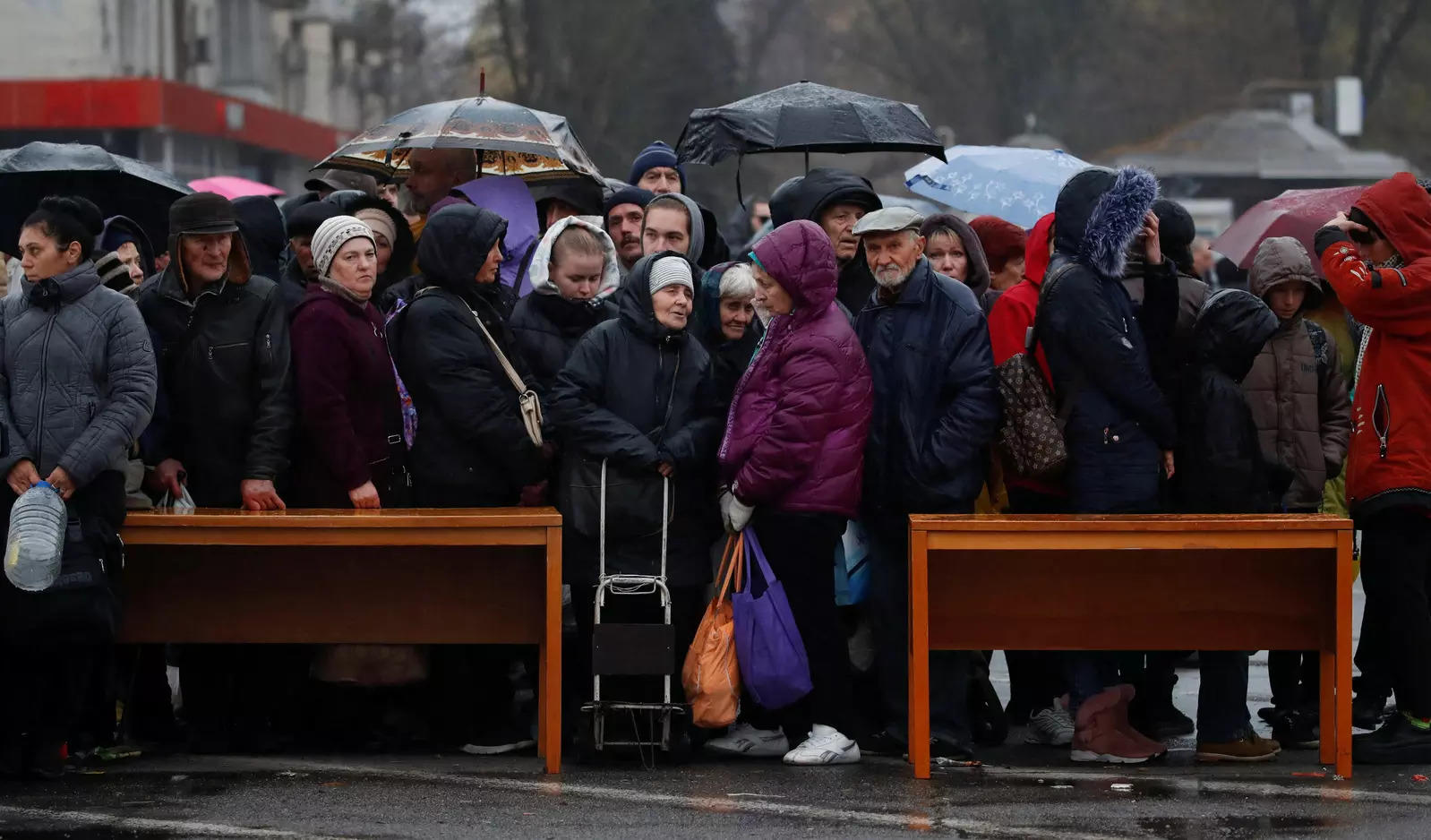 File: People wait for food aid after Russia's retreat from Kherson, as Russia's attack on Ukraine continues, Ukraine