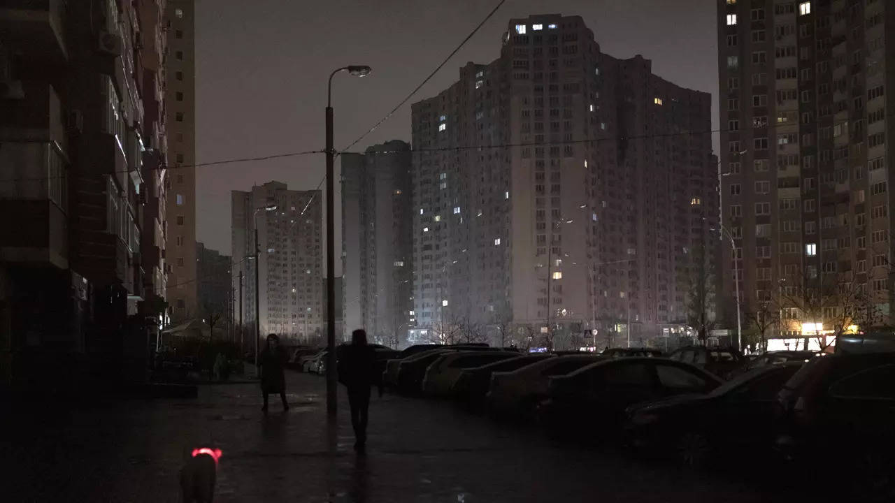 File: A dog with a lit up collar walks in a street during a blackout in Kyiv, Ukraine, Wednesday, November 16, 2022. (AP)