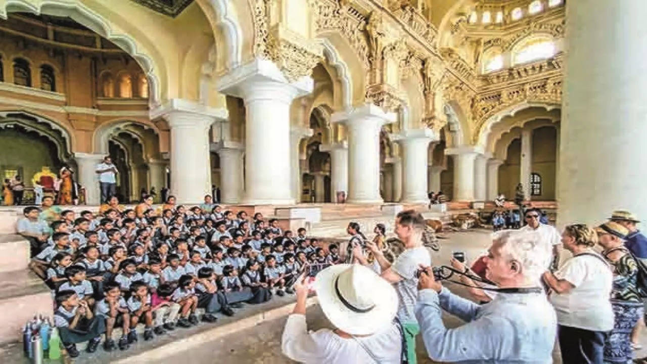 : A group of school children posng for a snap at the Thirumalai Nayak Palace in Madurai in MAdurai on Thursday