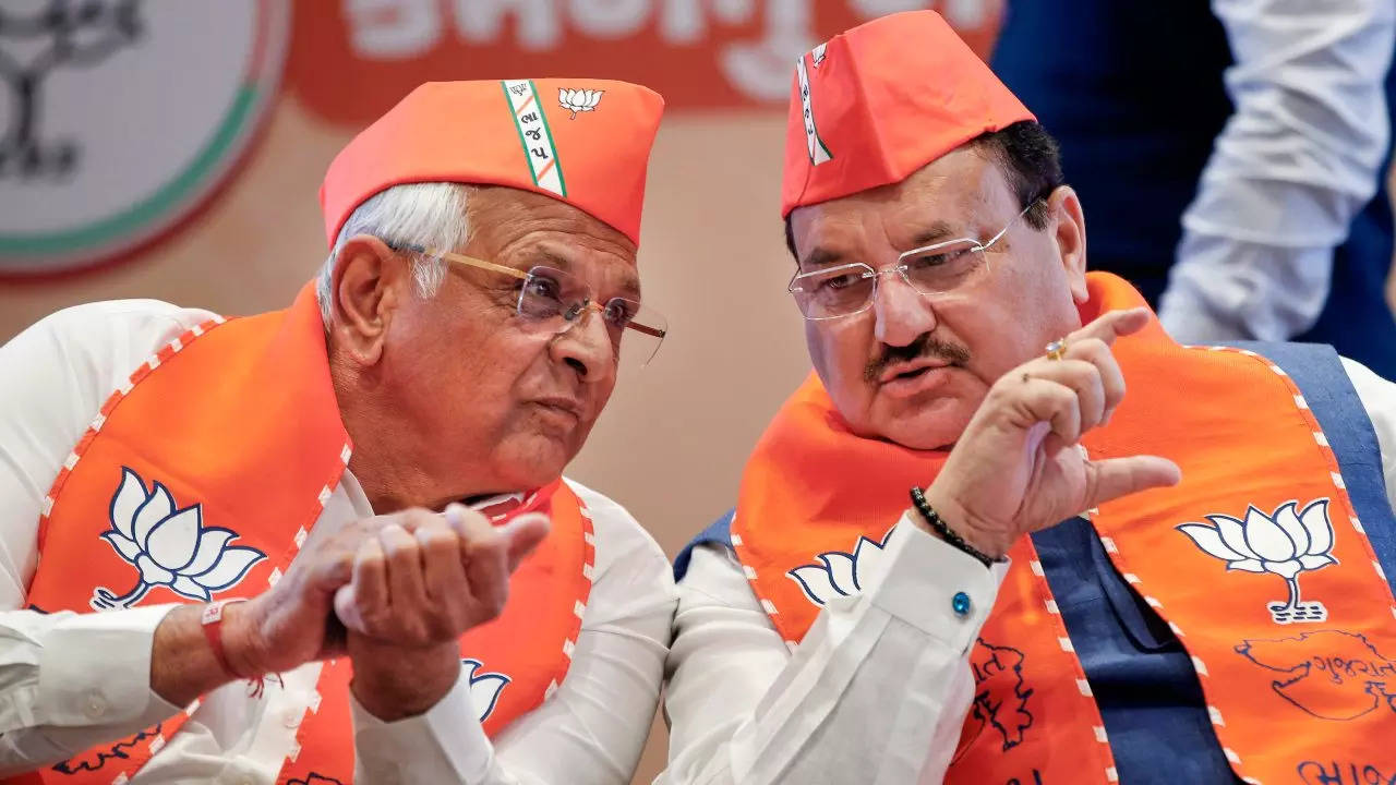 BJP national president JP Nadda (right) and Gujarat chief minister Bhupendra Patel during release of the party manifesto. (PTI)