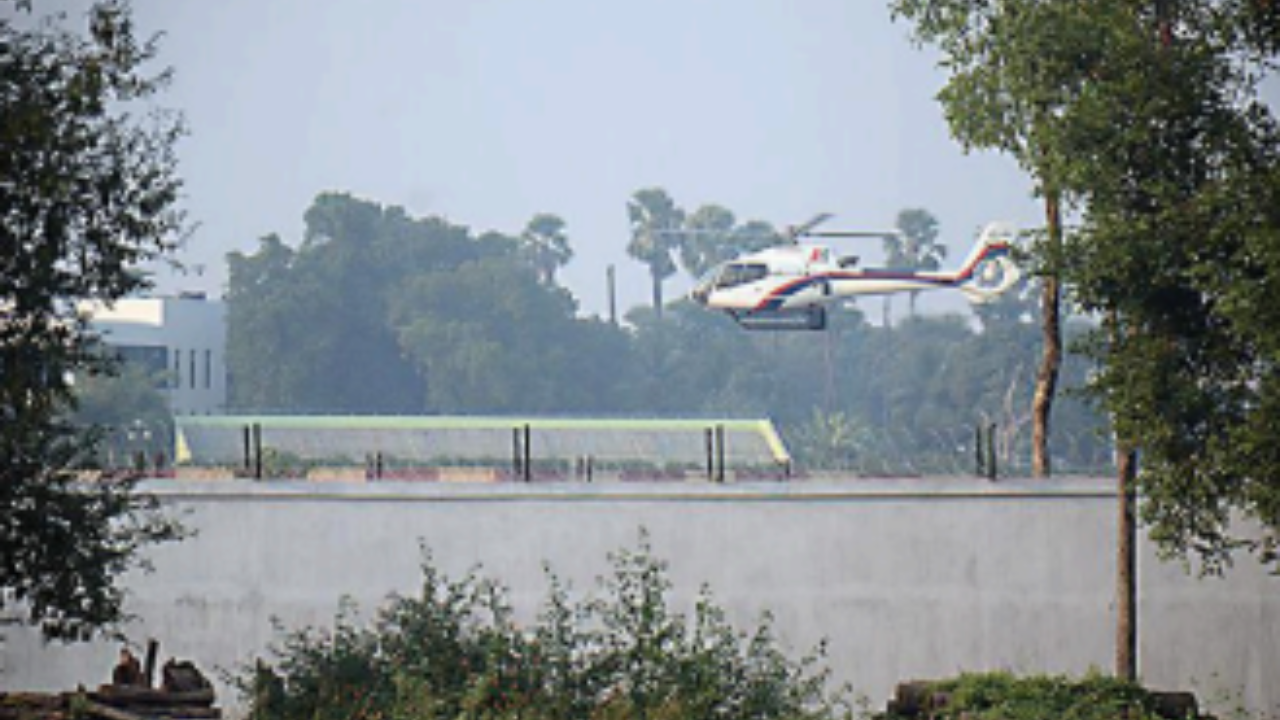 A helicopter lands at Patna airport amid smog on Saturday