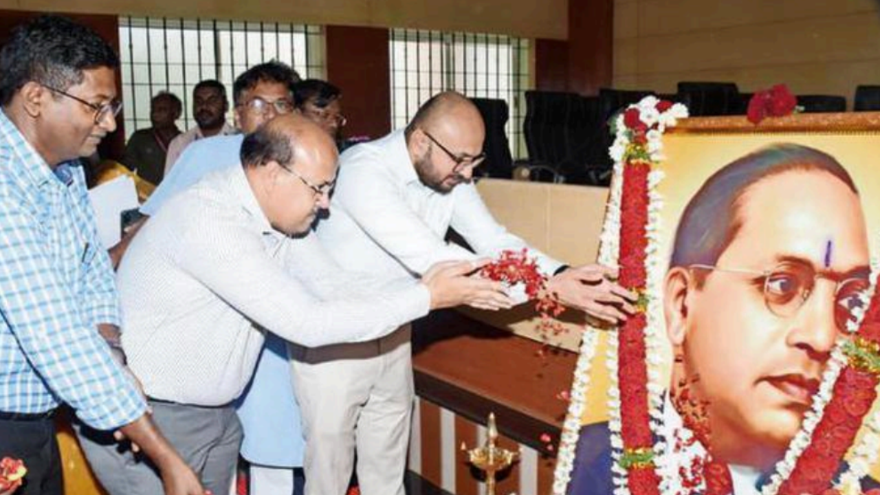 Dharwad DC Gurudatt Hegde and zilla panchayat CEO Suresh Itnal offer floral tributes to the architect of India’s Constitution BR Ambedkar at Dharwad on Saturday