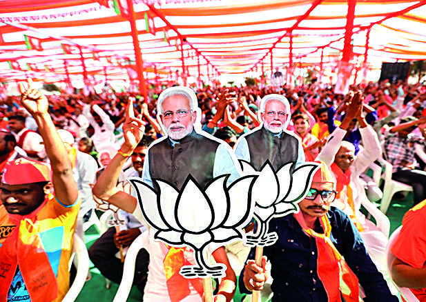 Prime Minister Narendra Modi during an election campaign roadshow for Assembly polls. (PTI Photo) 