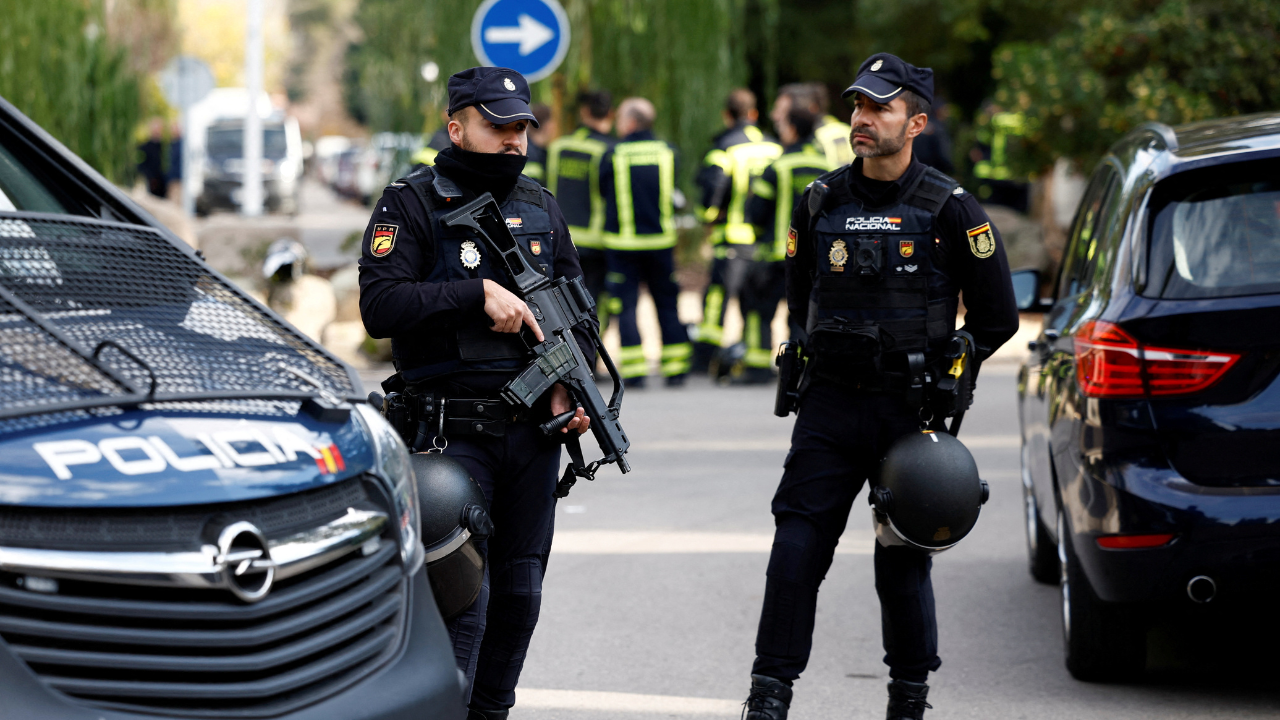 <p>Police officers stand guard as they cordon off the area next to the Ukrainian embassy in Madrid, Spain (AP)<br></p>