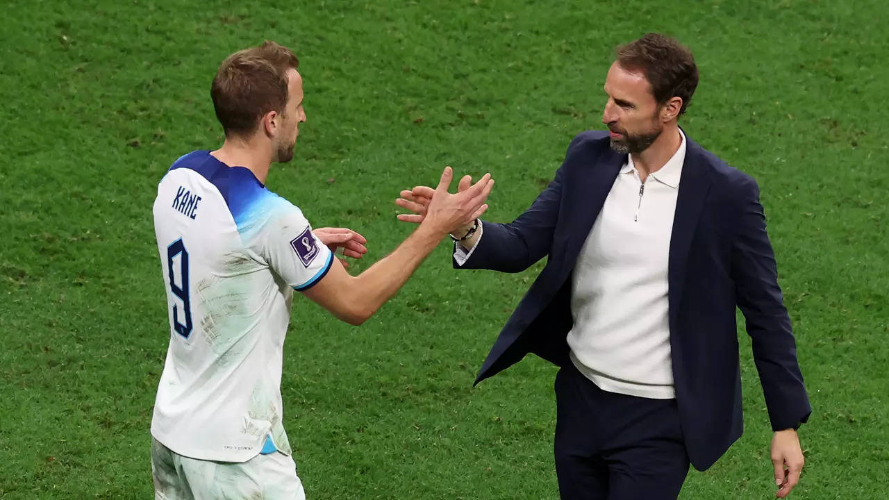 England manager Gareth Southgate shakes hands with captain Harry Kane after the win over Senegal in the last-16 round of the FIFA World Cup 2022 in Qatar (Photo by Alexander Hassenstein/Getty Images)