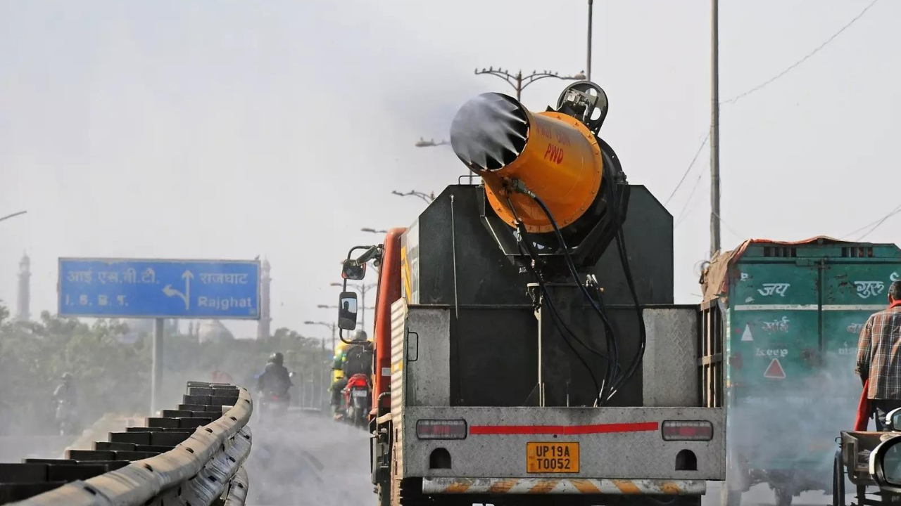 An anti-smog gun sprinkle water to curb air pollution, in New Delhi on Wednesday. (Photo: IANS)
