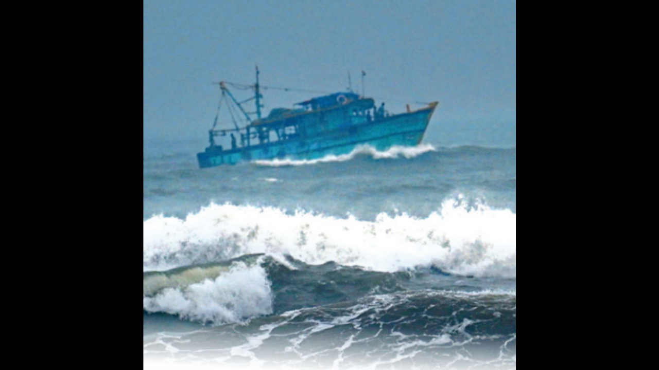 A fishing trawler sails amid huge waves near the Kasimedu fishing harbor on Thursday