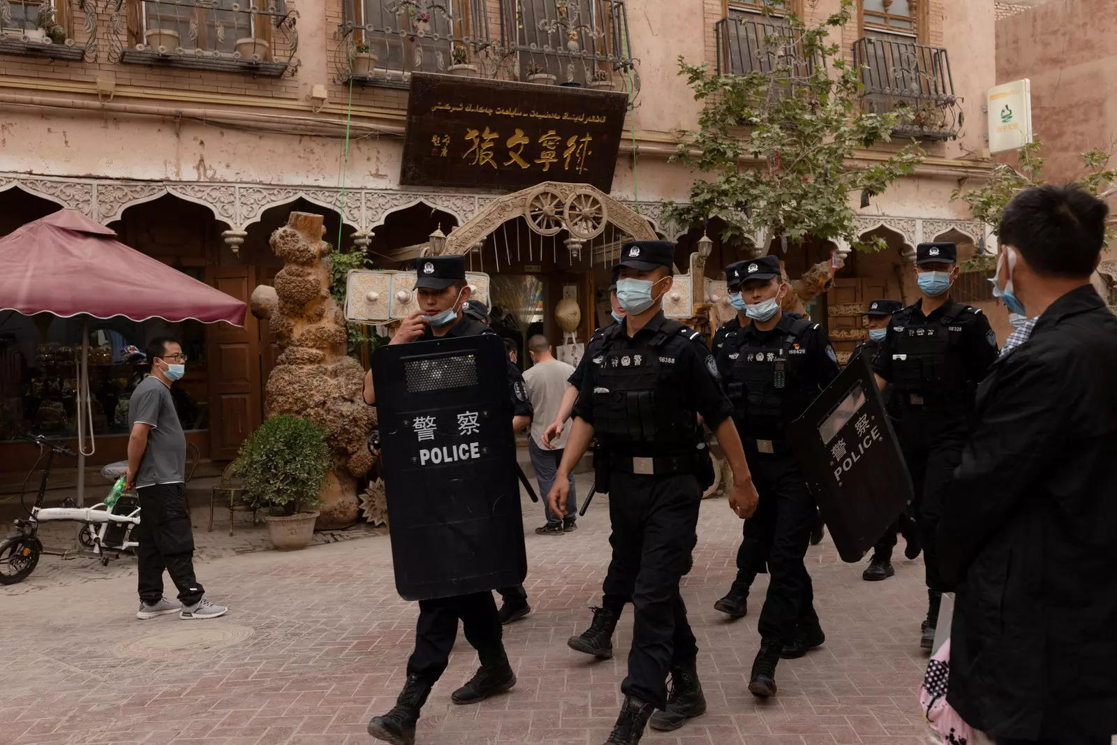  Police officers patrol in the old city in Kashgar, Xinjiang Uyghur Autonomous Region, China,  