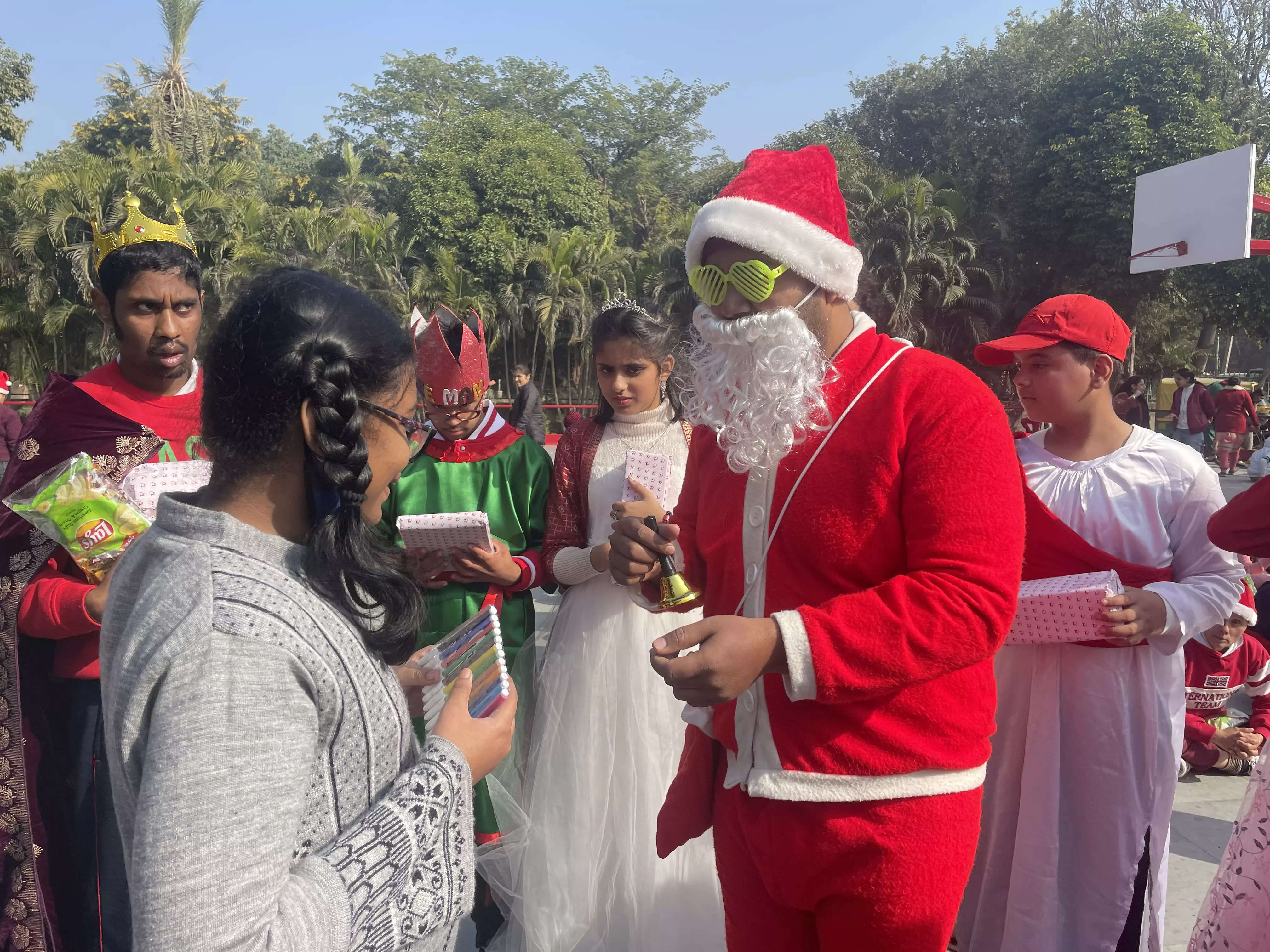 Ho ho ho: Real-life Santas spread Christmas cheer among kids in