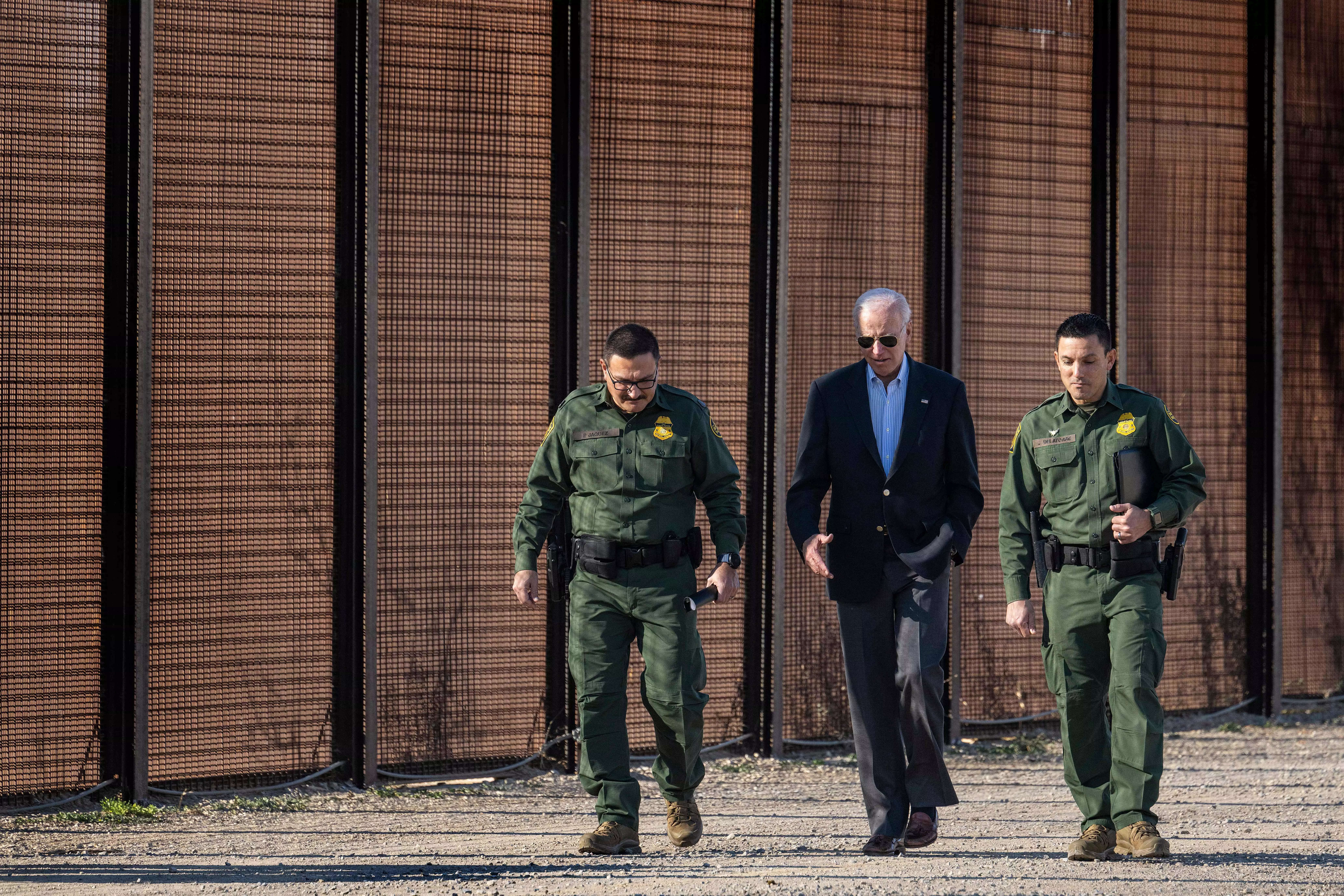 US President Joe Biden speaks with US Customs and Border Protection officers as he visits the US-Mexico border in El Paso.