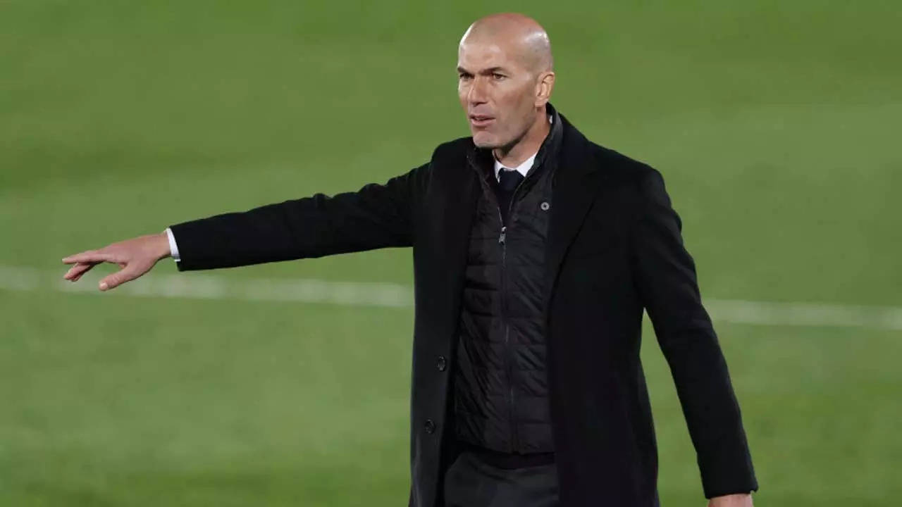 French soccer star Zinedine Zidane displays his new Real Madrid News  Photo - Getty Images