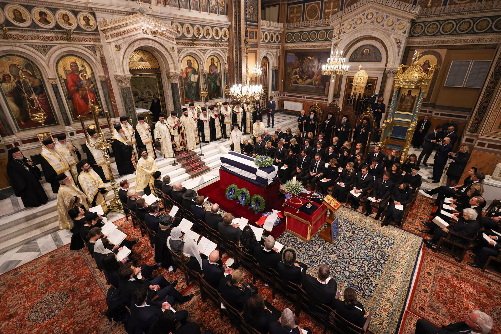 People attend the funeral service of former King of Greece Constantine II in the Metropolitan Cathedral of Athens, January 16, 2023. (Reuters)
