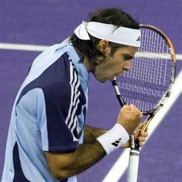 World's number one player, Switzerland's Roger Federer prepares to serve a  ball against Argentina's David Nalbandian (unseen) during the opening match  for the Shanghai Tennis Masters Cup held at the Qi Zhong