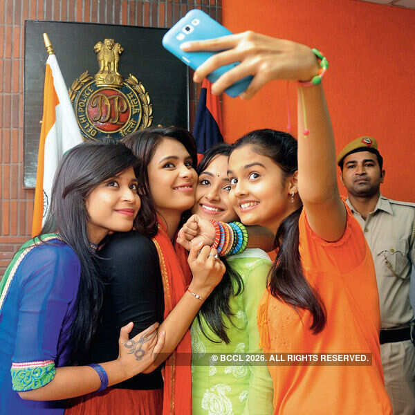 Neha Pednekar Tying A Rakhi To Sub Inspector Kamal Verma Photogallery