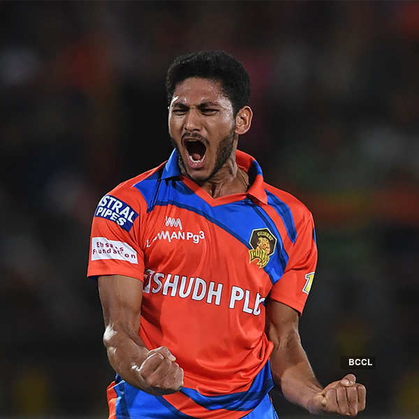 Gujarat Lions cricketer Basil Thampi celebrates the wicket of