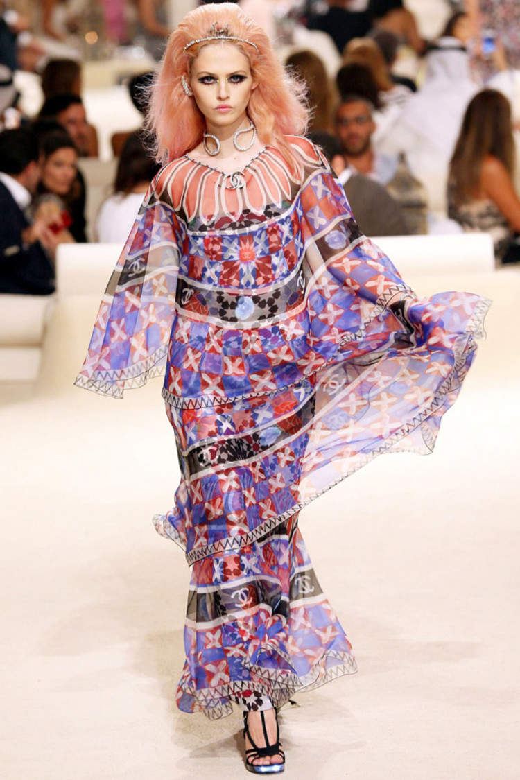 A model presents a creation from Chanel's 2014/15 Cruise