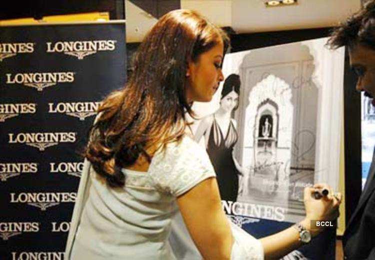 Aishwarya Rai Bachchan signs her ad at the launch of Longines