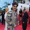 <i class="tbold">mame khan</i>