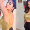 Article image for: <i class="tbold">kate sharma</i> says 'I look like a doll' posing in a golden top and black short skirt