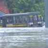 A police van stuck in floodwater near Kashmere Gate area in Delhi.