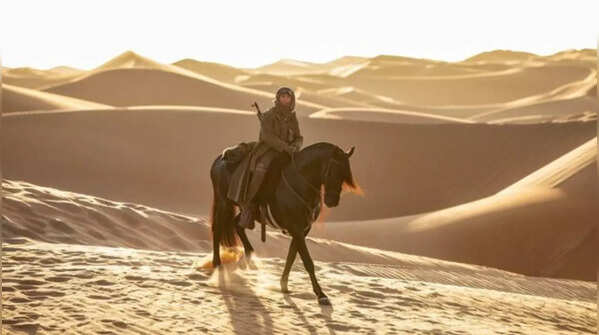 Horse riding through the desert