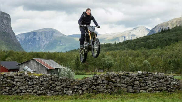 Riding a motorcycle off a cliff in the mountains of Norway