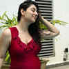 Flaunting her baby bump in a swimsuit