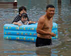Chinese citizens evaluate losses in the wake of Typhoon Doksuri