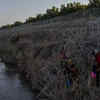 Article image for: Asylum-seekers traverse Rio Grande into the US