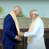 Prime Minister Narendra Modi welcomes United States President Joe Biden as he arrives at Delhi's Rajghat to pay homage to Mahatma Gandhi and lay a wreath.
