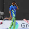 Pakistan's captain Babar Azam walks on the field as the wet ground delays the resumption of the match in Colombo, Sri Lanka on Monday.