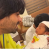 Shoaib holding Ruhaan for the first time