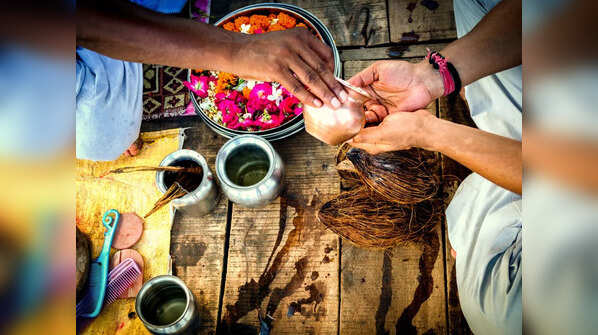 Which hand is considered suitable for wearing the holy thread?