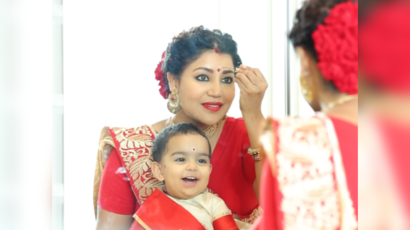 Before they grow out, Divisha and Lianna wear Lal par sada saree