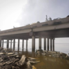 A vehicle went over highway guardrail and into the water
