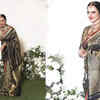 Article image for: Rekha indulges in fun banter with photographers and videographers, looks gorgeous in golden and <i class="tbold">black saree</i> with red border