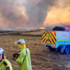 ​Warm winds fueling fast-moving flames​