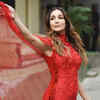 strapless open back dress Malaika Arora in Ruby Red Satin Saree with Embroidered Belt