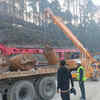 Rescue teams are preparing to set up a vertical drill machine and its parts on the top of the tunnel.