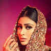 Mouni Roy makes heads turn in a shimmery golden hoodie gown | Times of India