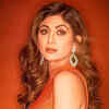 shilpa shetty orange dress Shilpa Shetty in a vibrant orange saree keeps it simple yet stylish