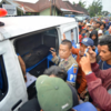 Forensic workers preparing to identify body 
