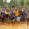 ​Supporters dance and chant