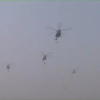 Helicopter in Dhwaj formation shower flowers on the audience of the Republic day parade