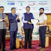 ​Panelist congratulating the winner